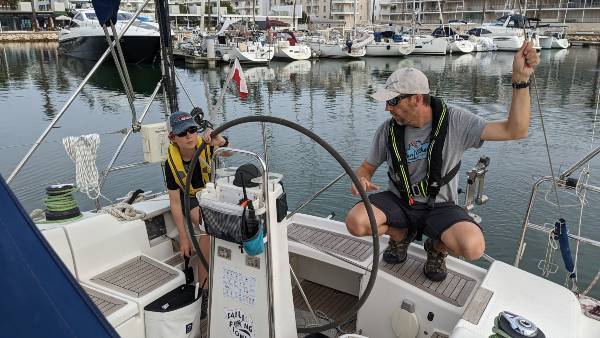 Image of individuals skippering a boat